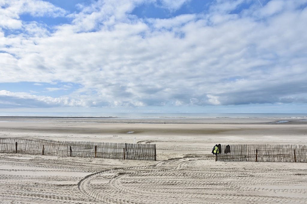 Beautiful sandy beach with cloudy sky at Le Touquet-Paris-Plage in France.
